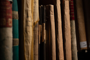 Old logbook. Historical researches background.  Old files and archives on a shelf close up.