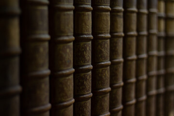 Old books collection. Brown covers and bindings. Encyclopedia or bible background. Antique library.