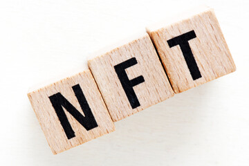 NFT word composed of wooden letters.