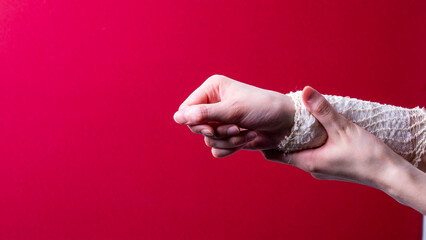 Fototapeta premium woman's hand bandaged with a medical bandage