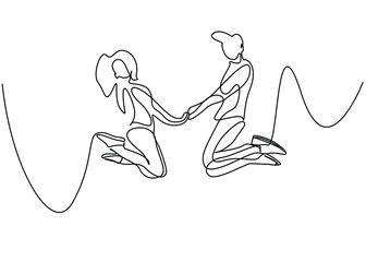 couple in love jumping holding hands and rejoicing.