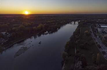 Beautiful aerial sunset on Ticino river in Pavia, Italy
