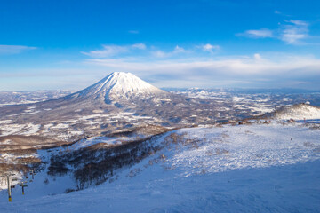 Snowy volcano viewed from a ski resort in late afternoon (Niseko, Hokkaido, Japan)
