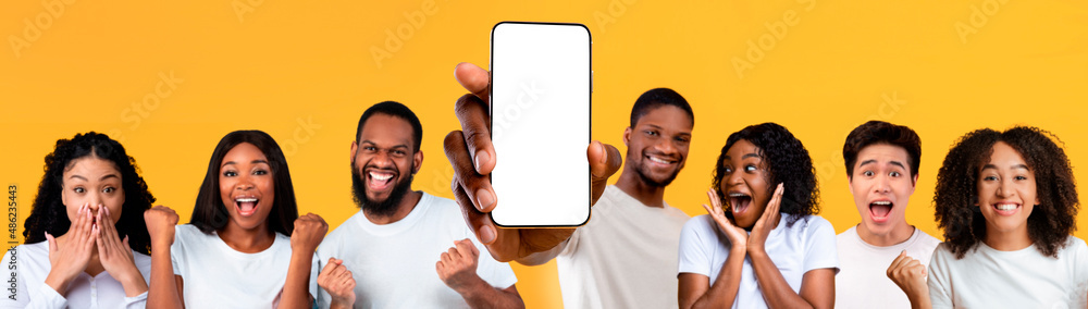 Poster happy people showing white empty smartphone screen and gesturing yes