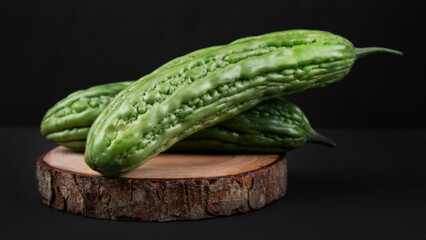 Bitter Melon on a Wooden Coaster