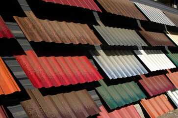 Samples of roof tiles on wall of the store	