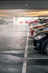 Row of cars in a car park or dealership. Selective focus. Vertical image