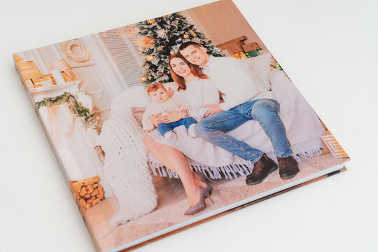 cover of Photobook with photos of family photo shoot.