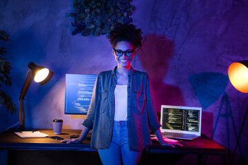 Photo of smart lady designer stand desk java script service error solving in evening late workplace...