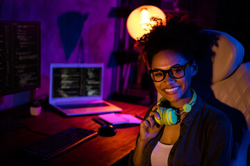 Photo of happy lady freelancer earphones sit desk ready esport tournament in modern professional...