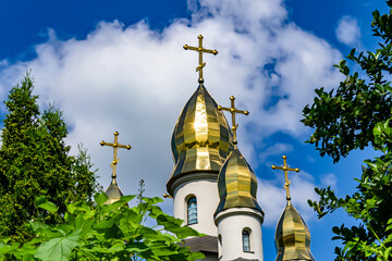 Christian church cross in high steeple tower for prayer