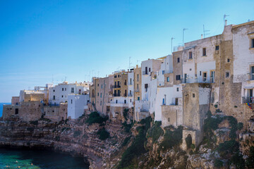 Fototapeta na wymiar Polignano a Mare, historic city in Apulia. Buildings on the coast