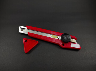 Abstract Defocused Red cutter and snapper blade isolated on black background