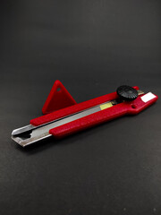 Abstract Defocused Red cutter and snapper blade isolated on black background