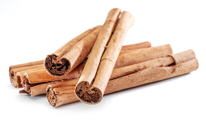 Cinnamon dried bark strips, sweet-smelling brown substance used in cooking, isolated on white background.