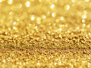 Sparkling golden powder. Festive background.