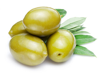Green olives with leaves on white background. Close-up.