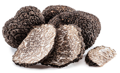 Black winter truffles and truffle slices on white background. The most famous of the trufflez.