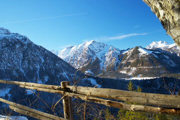 mountain path through a tunnel on a sunny winter day