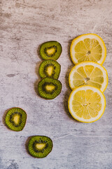 Lemons and kiwis. Seamless pattern of lemons on an industrial background. vertical shot. High quality photo