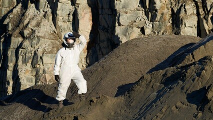 Astronaut exploring a rocky planet