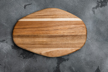 Cutting board, on gray stone table background, top view flat lay , with copy space for text or your product
