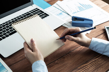woman with notepad in the office