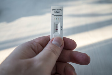 Positive sars-cov-2 antigen home test card.