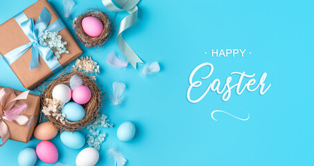 Festive, Easter background with gifts, eggs in a nest, flowers and feathers on a blue background.