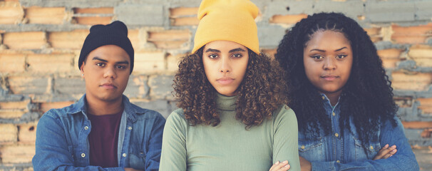 Serious latin american woman with multi ethnic friends