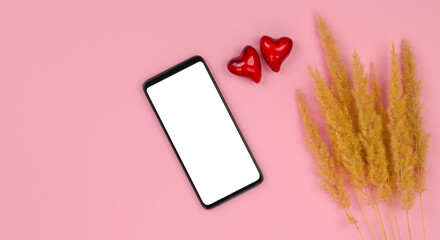 Smartphone mockup on a pink background with hearts. Blank for congratulations on Valentine's Day or Mother's Day
