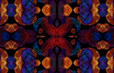 Abstract kaleidoscope background. Beautiful multicolor kaleidoscope texture. Unique kaleidoscope design in red and orange colors on a black background.
