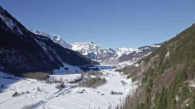 Aerial view of mountain panorama at the Swiss Alps seen from ski resort Engelberg. Movie shot February 9th, 2022, Engelberg, Switzerland.