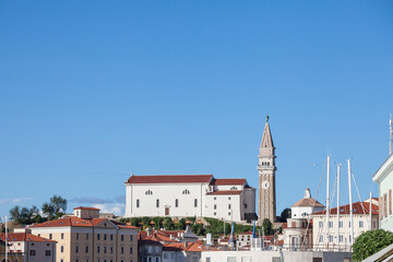 Panorama of Piran, in slovenia, with a focus on the parish church of saint george, or zupnjiska cerkev svetog jurija, a major landmark of the slovenian istria, in Piran...