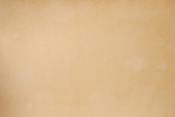 The texture of an old yellowed paper. Background.