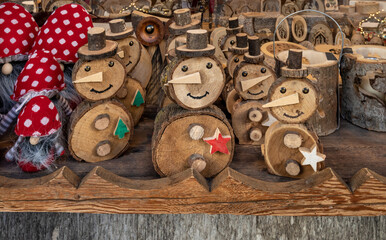 Wood souvenirs  on the display in  Ortisei, Italian village in Dolomites Alps.   - obrazy, fototapety, plakaty