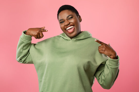 Joyful African American Lady Pointing Fingers At Herself, Pink Background