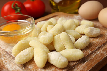 Concept of cooking with raw potato gnocchi, close up
