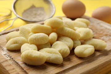 Concept of cooking with raw potato gnocchi, close up