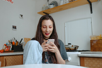 young woman at home on the kitchen