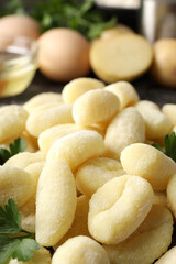 Concept of cooking with raw potato gnocchi, close up