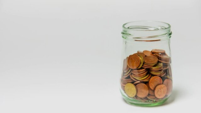 Time lapse 4K. Save money and account banking for finance concept, Hand with coin on blurred background
