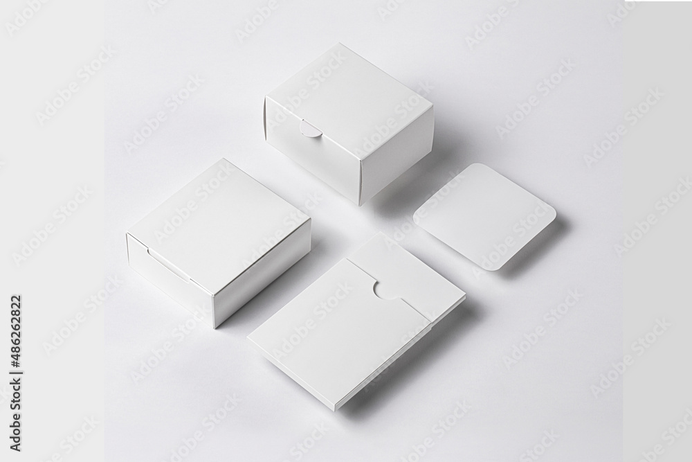 Poster empty blank boxes, instruction book case and square card branding set mockup template isolated over 