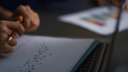 Business consultant hands write corporate papers research charts in office table