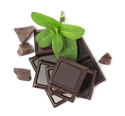 Tasty dark chocolate pieces with mint on white background, top view