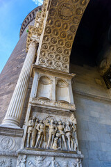 One side of the gate at the entrance to the New Castle in Naples. With the tower and the sculptures...