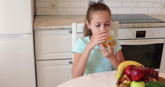 the child eats fruits with pleasure. The girl eats healthy food. the concept of children's health