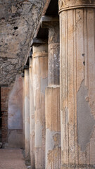 Fototapeta na wymiar Pompeii columns lined up, foreground