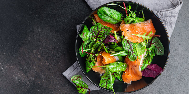 salad salmon slices green salad mix seafood fresh portion dietary healthy meal food diet snack on the table copy space food background keto or paleo  vegetarian food no meat pescatarian diet