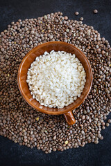 Rice and lentils on a dark background. Complete protein sources. Complete vegan protein. Healthy food